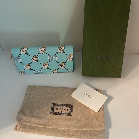 GUCCI ANIMAL PRINT ZIP-AROUND WALLET IN
BLUE BRAND NEW with Dustbag - Picture 4 of 5